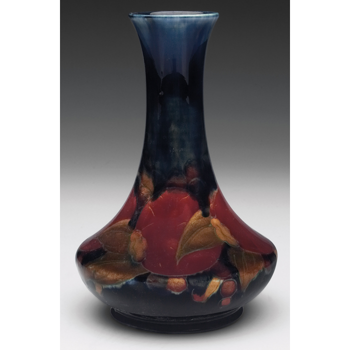 Appraisal: Slender Moorcroft vase pomegranate design on dark ground impressed mark