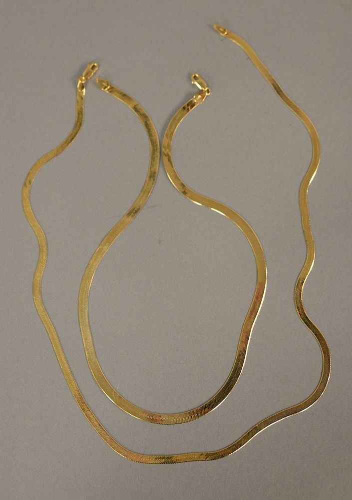 Appraisal: Two K gold flat necklaces in and in gr Two