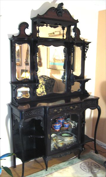 Appraisal: EDWARDIAN ETAGERE shaped and beveled mirrors over fret carved lower