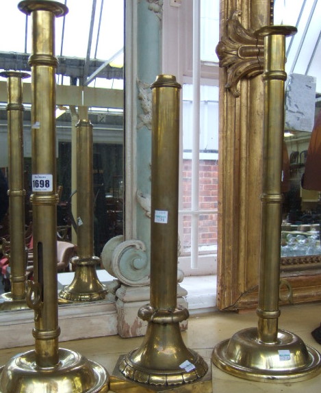 Appraisal: A pair of brass candlesticks early th century the tall