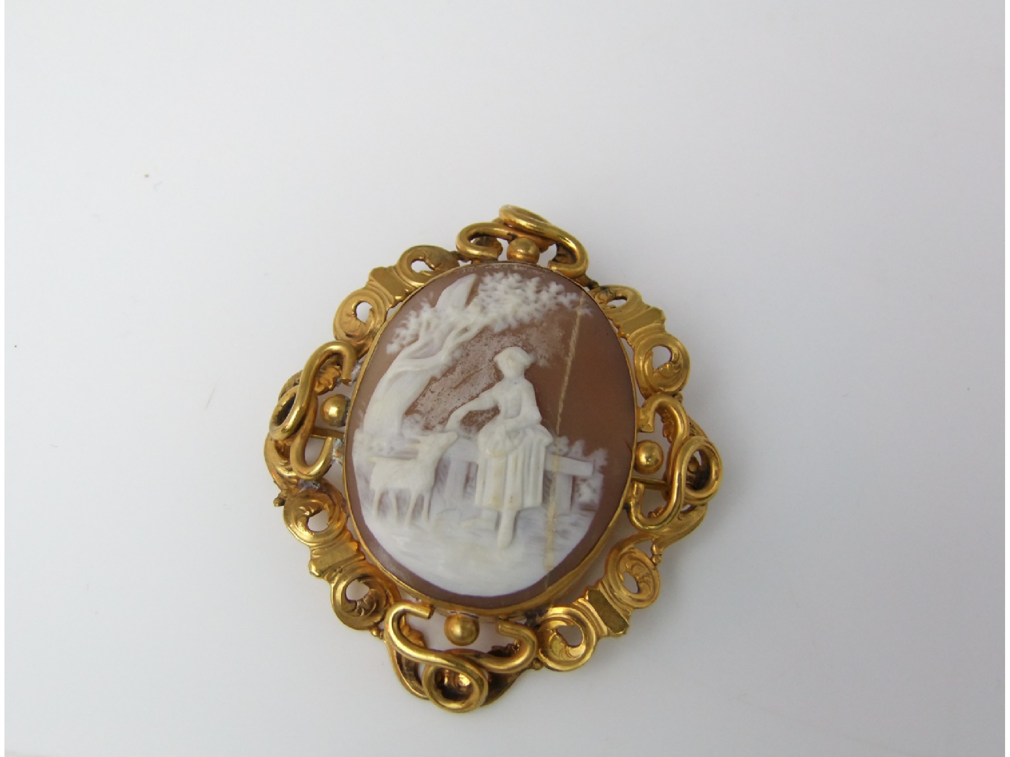 Appraisal: A th century cameo brooch with pierced and scrolled framework