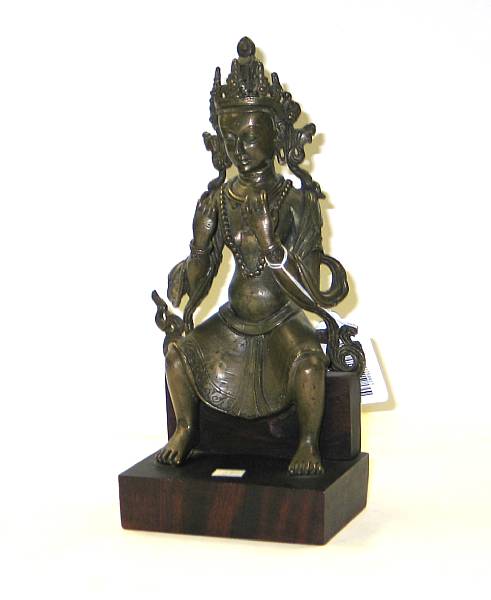 Appraisal: A Himalayan cast bronze seated Buddhist figure Possibly depicting Maitreya