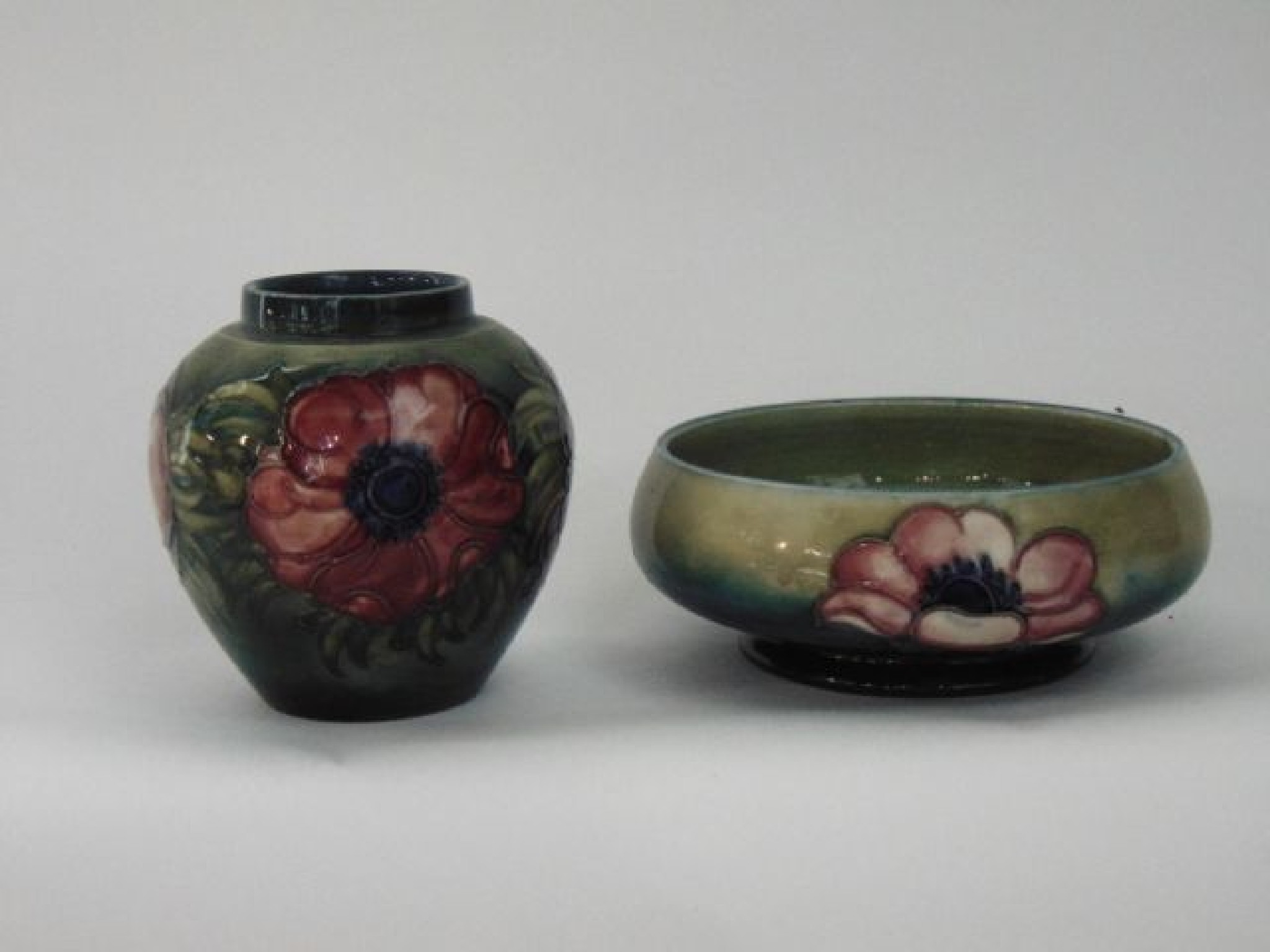 Appraisal: A Moorcroft bowl of shallow form with painted pink and