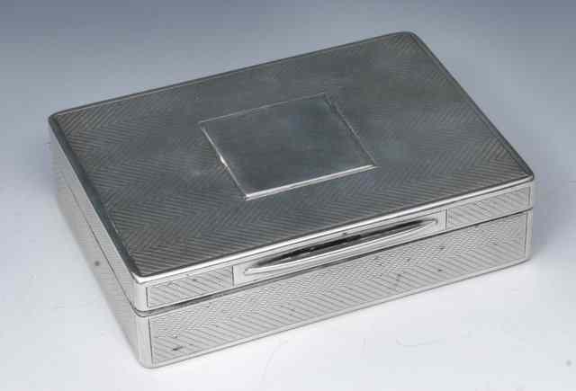 Appraisal: A SILVER CIGARETTE BOX solid with engine turned decoration and