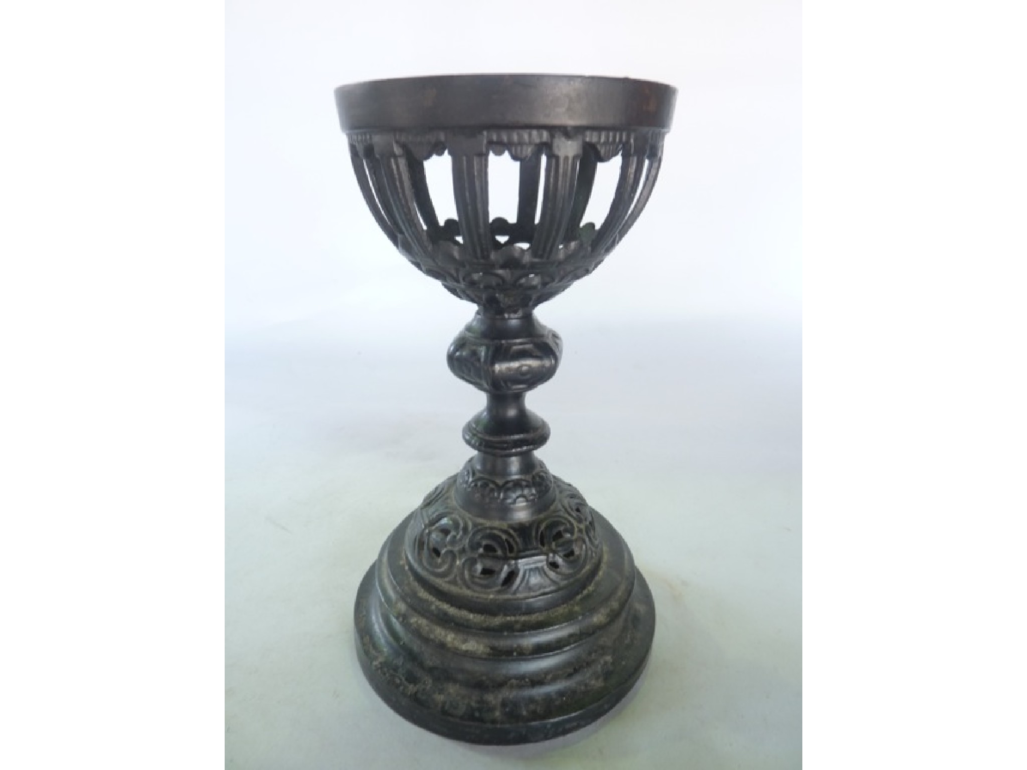 Appraisal: A heavy cast iron lamp fount with all over blackened