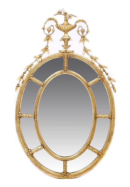 Appraisal: A George III style oval giltwood and gesso mirror height