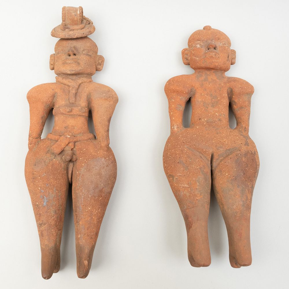 Appraisal: El Salvadorian Terracotta Male and Female Figures The larger in