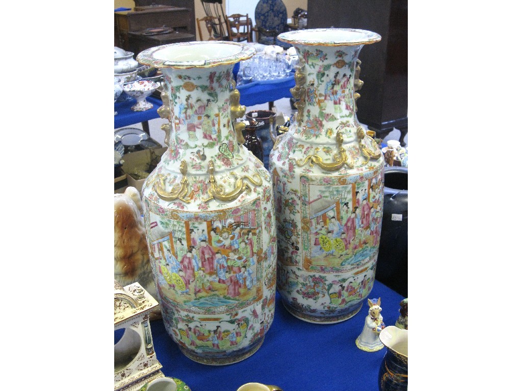 Appraisal: Pair of large Famille rose vases profusely decorated and with