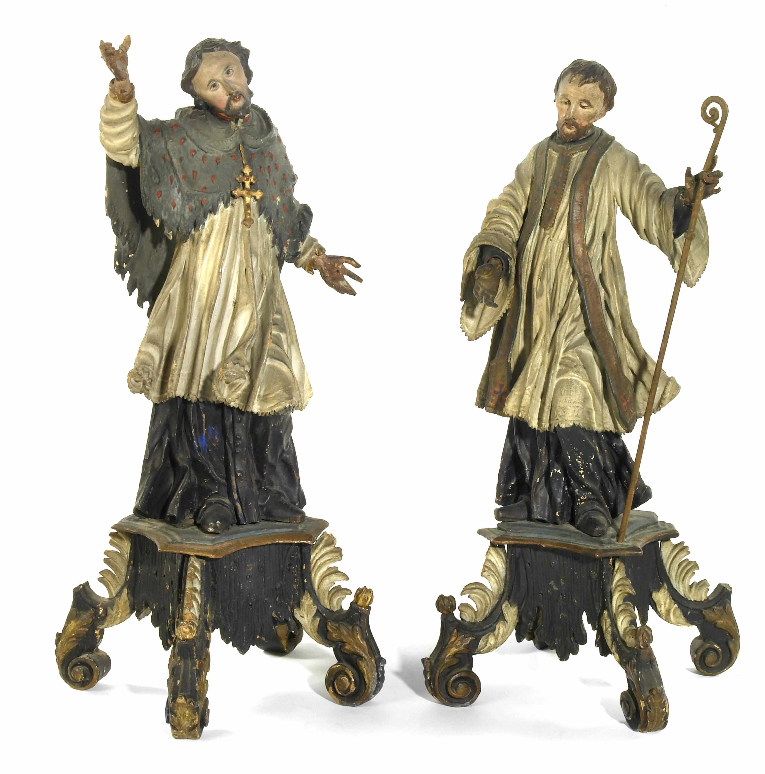 Appraisal: A pair of Austrian Baroque carved wood and polychrome decorated