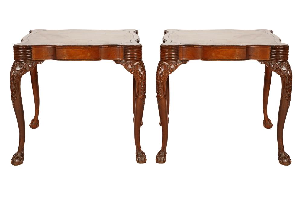 Appraisal: PAIR OF MAHOGANY LEATHER-INSET END TABLES th century with carved