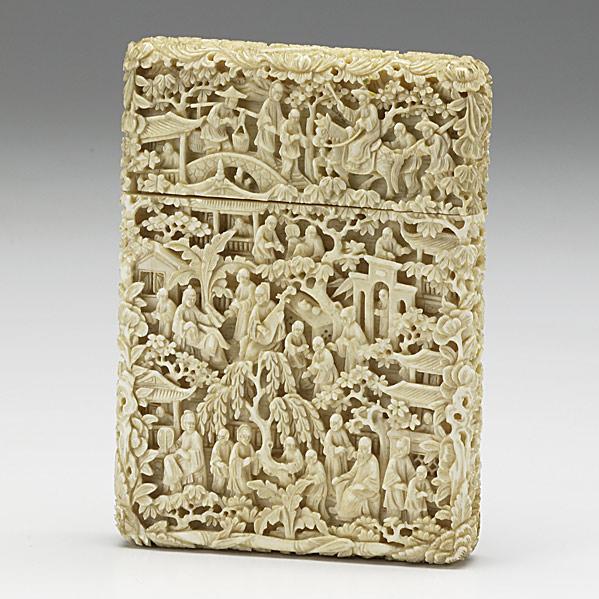 Appraisal: IVORY CARD CASEProfusely carved with figures and trees on all