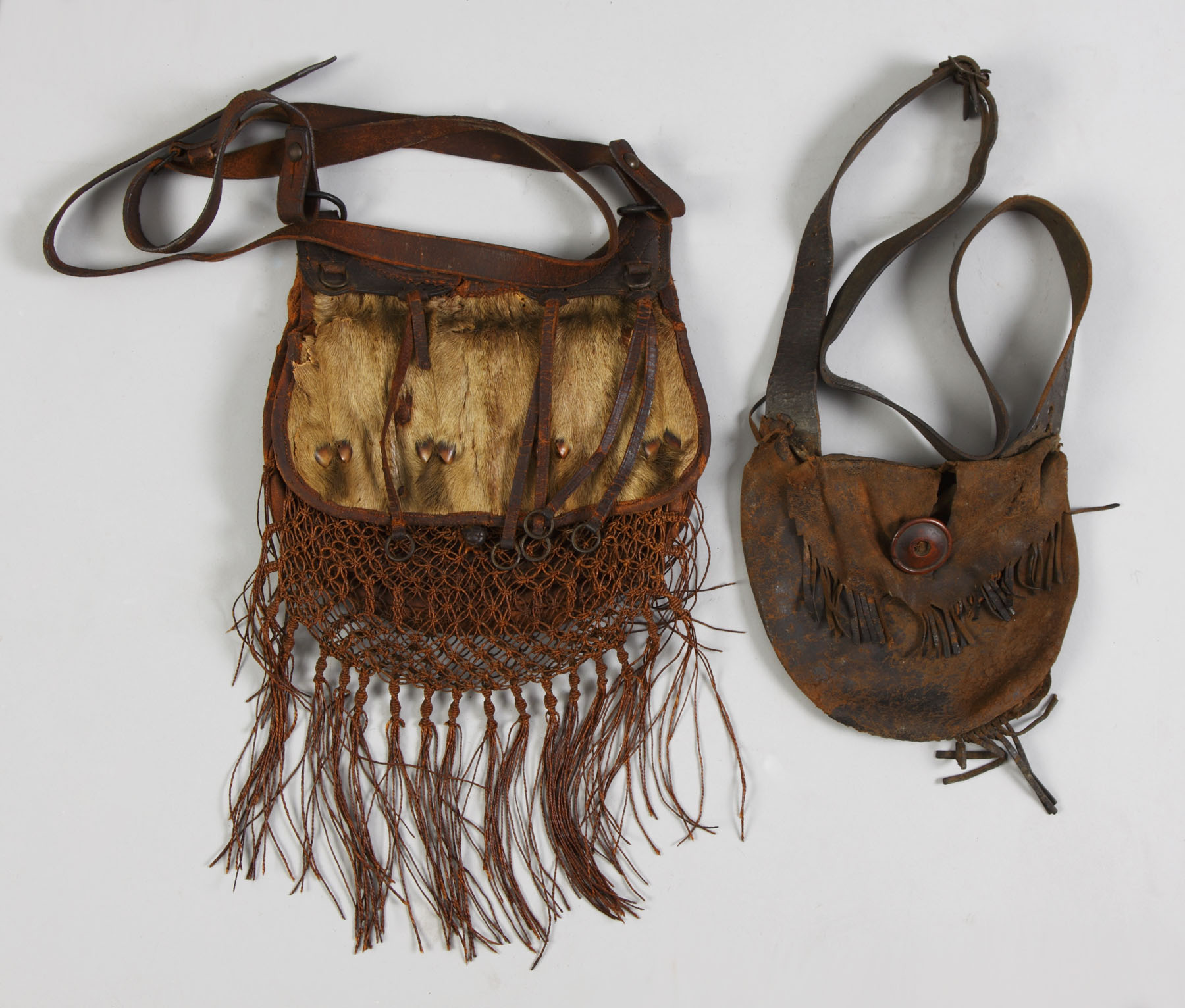 Appraisal: th Century Leather Hunting Pouches L - fur hoof decorations