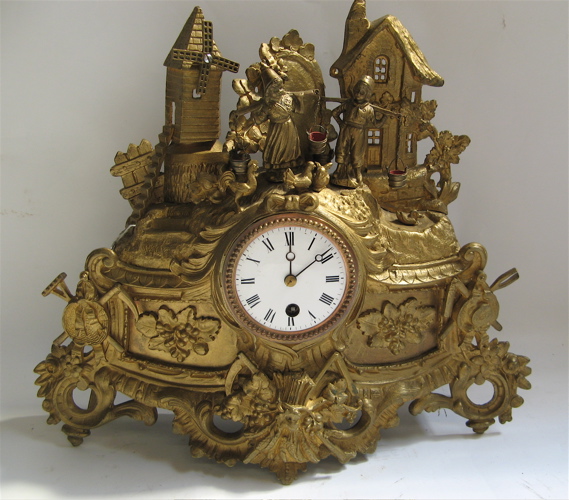 Appraisal: A FRENCH FIGURAL SHELF CLOCK The gilt metal case having