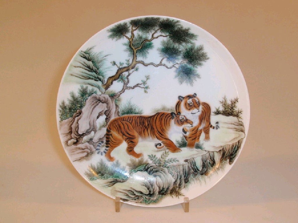 Appraisal: A Chinese porcelain plate painted with two tigers on a