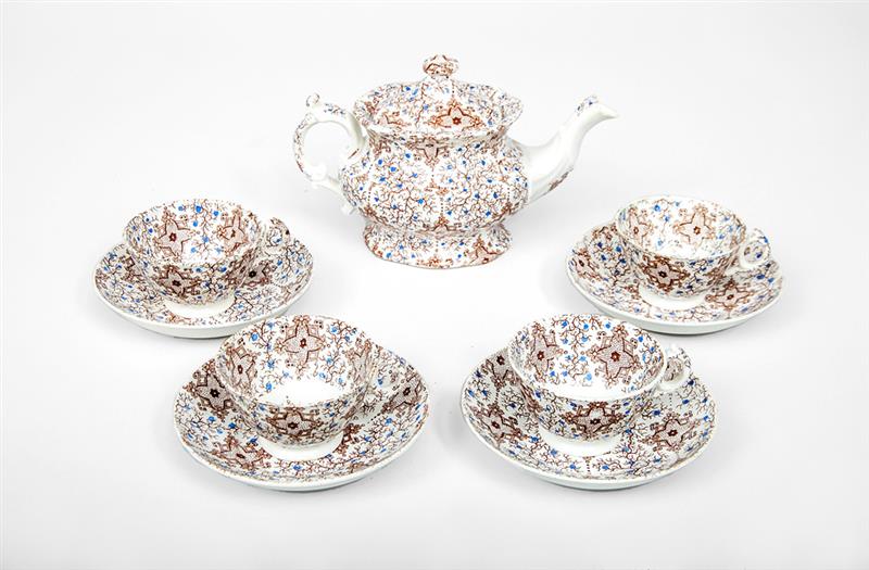 Appraisal: English Porcelain Transferware Teapot and Four Cups and Saucers Teapot