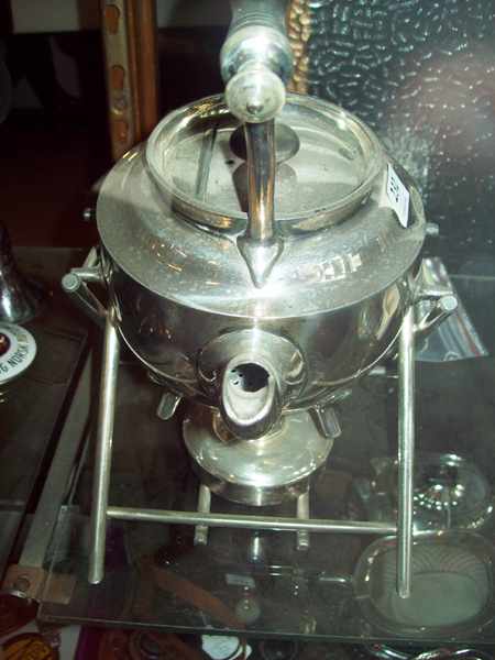 Appraisal: A SILVER PLATED KETTLE ON STAND