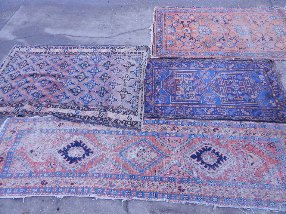 Appraisal: A Persian type rug with geometric devises within multiple borders