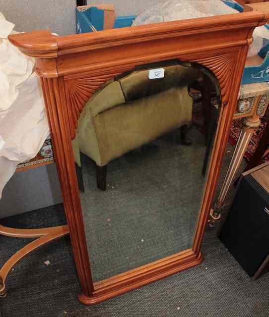 Appraisal: A CONTINENTAL BEECH WOOD PIER GLASS with reeded frame over