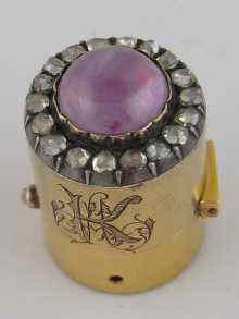 Appraisal: A gold scent bottle top with engraved cipher and set