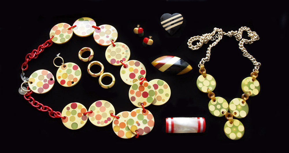 Appraisal: POLKA DOT AND LAMINATED BAKELITE To include an disc dot