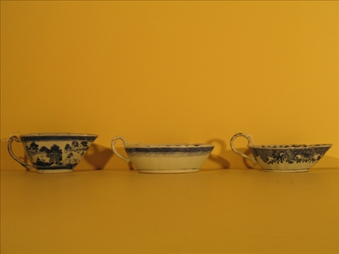 Appraisal: THREE CHINESE EXPORT BLUE AND WHITE SAUCEBOATS Late th c