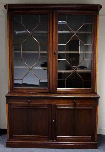 Appraisal: An Edwardian mahogany secretaire bookcase with astragal glazed cupboard above