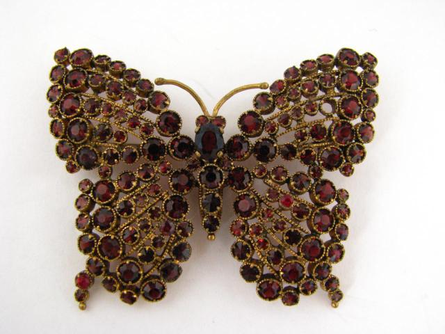 Appraisal: Gold plated x mm garnet butterfly motif pin weighing dwt