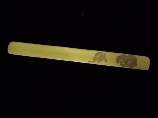 Appraisal: A Japanese ivory letter knife Meiji period decorated monkeys cm