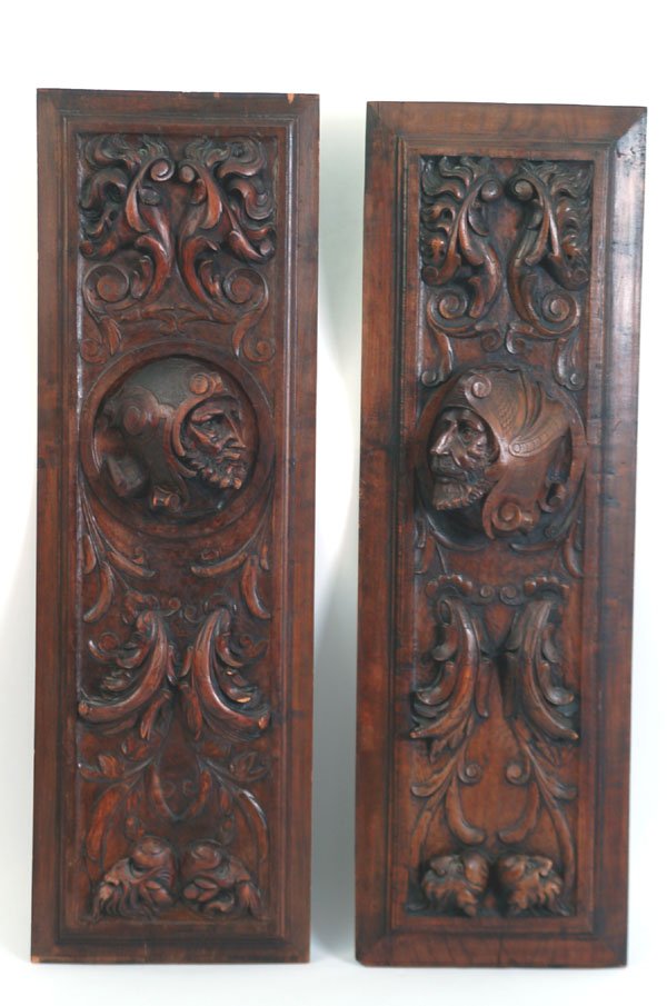 Appraisal: Two deeply carved wooden panels Both with heads of bearded