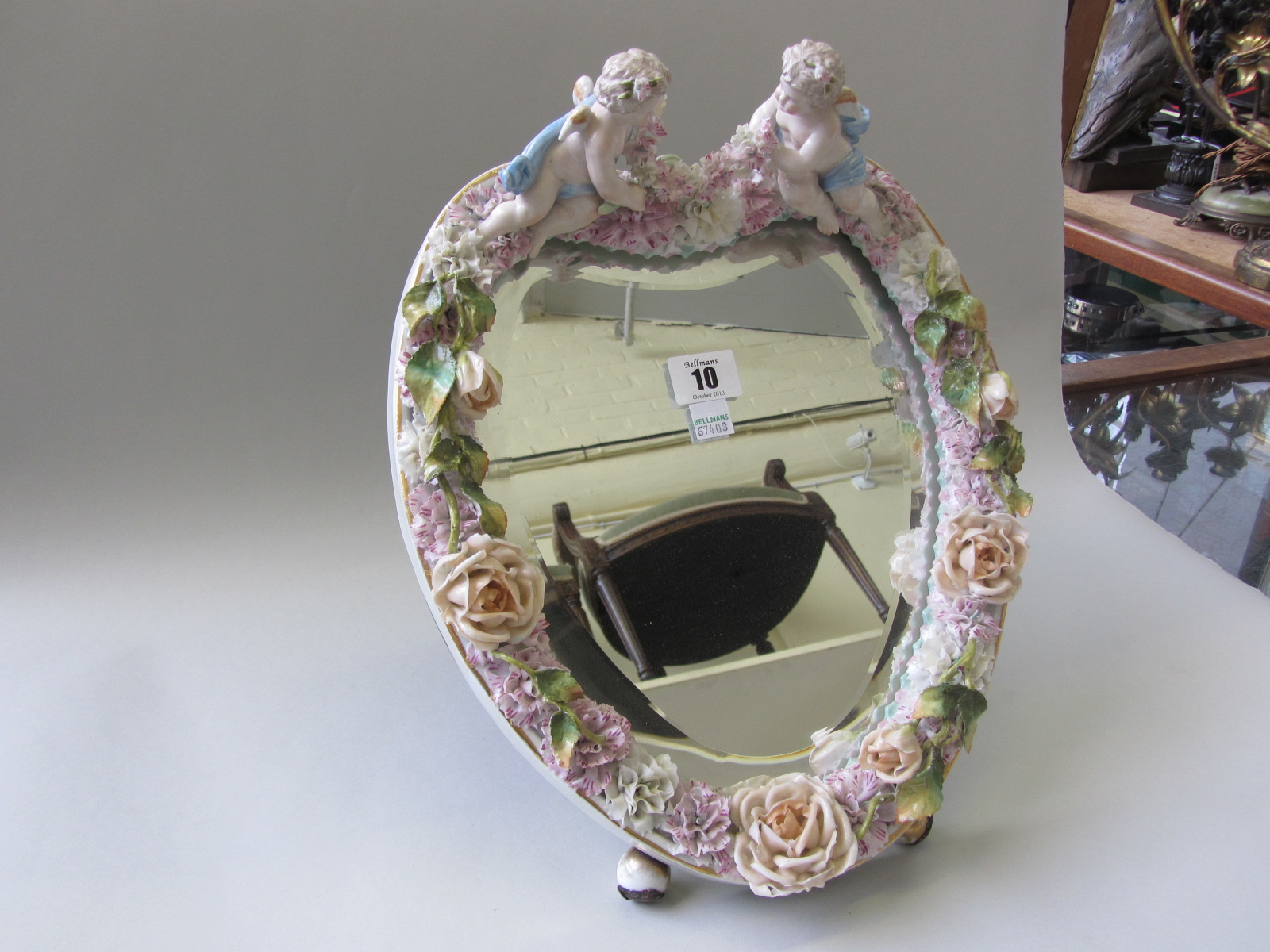 Appraisal: A Continental porcelain table mirror of heart shaped form th