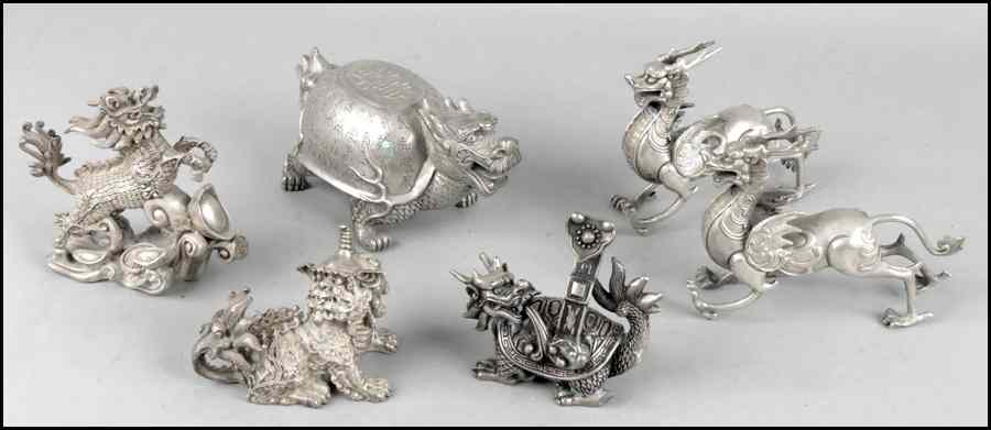 Appraisal: PAIR OF CHINESE SILVERED BRONZE WINGED ANIMALS Together with four