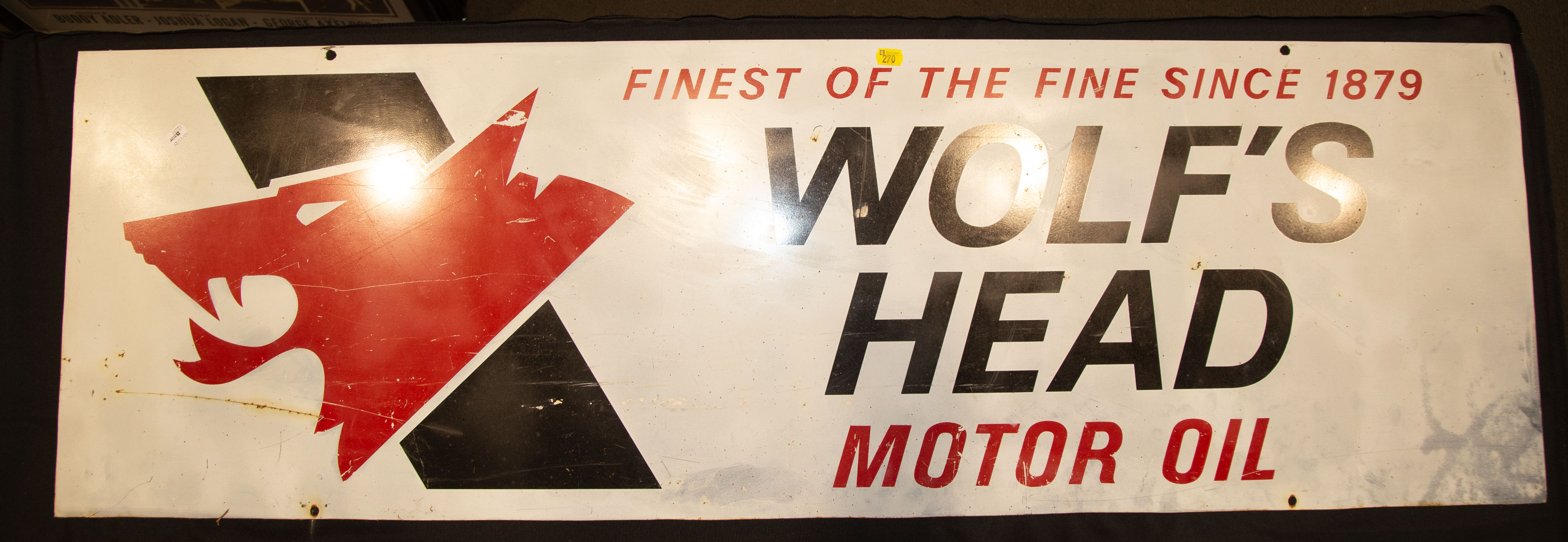 Appraisal: WOLF'S HEAD OIL PRINTED METAL SIGN in H in W