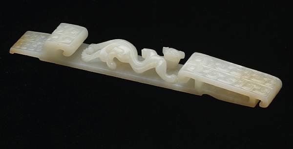 Appraisal: A white jade archaistic ornament th Century Carved in the