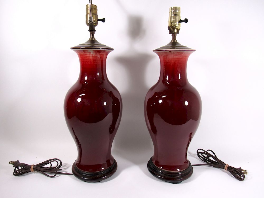 Appraisal: Pair of Oxblood Vases as Lamps Chinese porcelain with sang