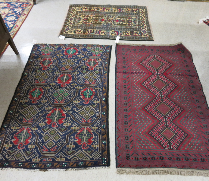 Appraisal: THREE HAND KNOTTED BELOUCHI TRIBAL AREA RUGS ' x '