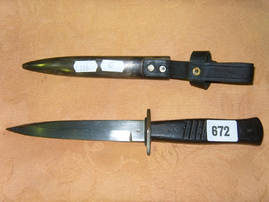 Appraisal: A German trench fighting knife and scabbard