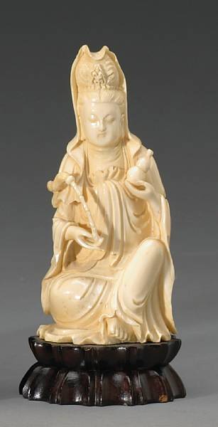 Appraisal: A carved ivory figure of Guanyin th Century Seated in