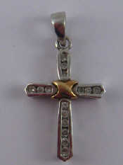 Appraisal: A white metal tests carat gold diamond set cross approx