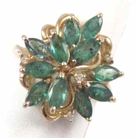 Appraisal: EMERALD AND DIAMOND CLUSTER RING k yellow gold set with