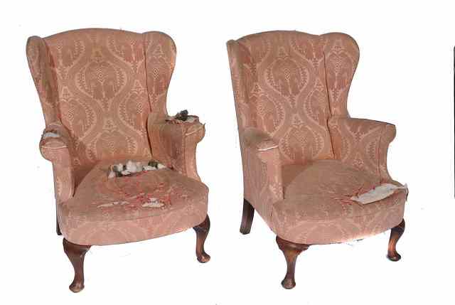 Appraisal: A PAIR OF PINK UPHOLSTERED GEORGIAN STYLE WING BACK ARMCHAIRS