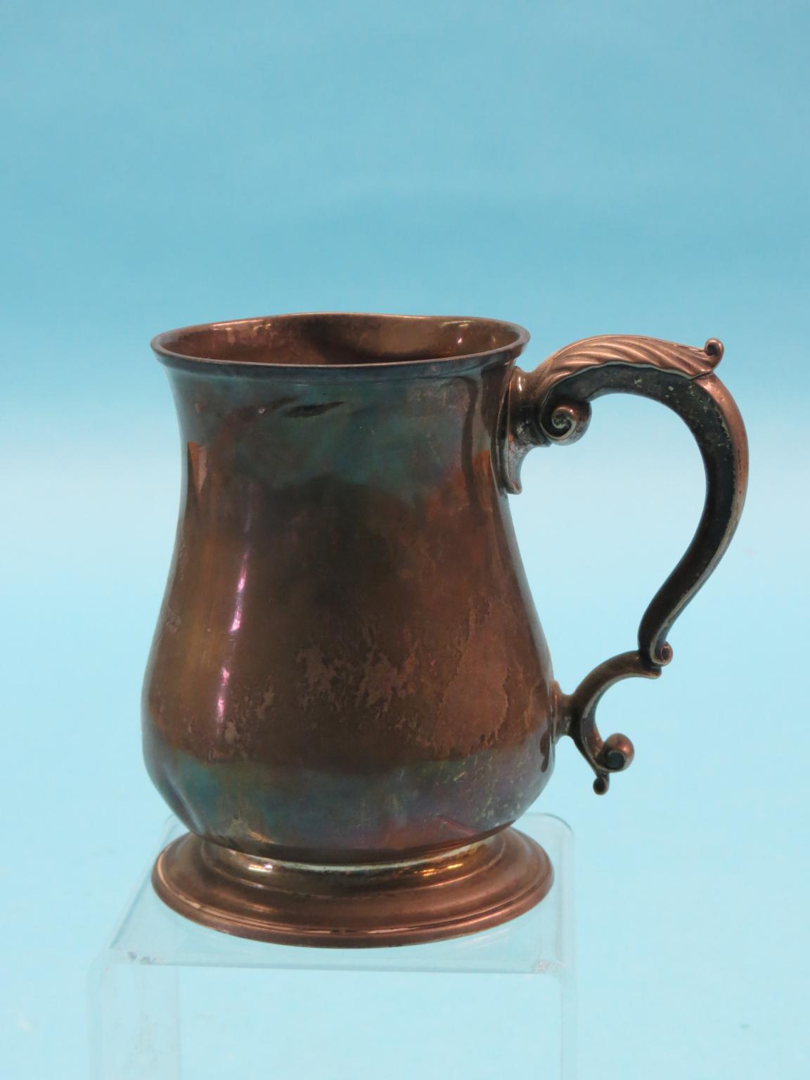 Appraisal: A Georgian silver pint tankard baluster-shape with double-scroll handle London