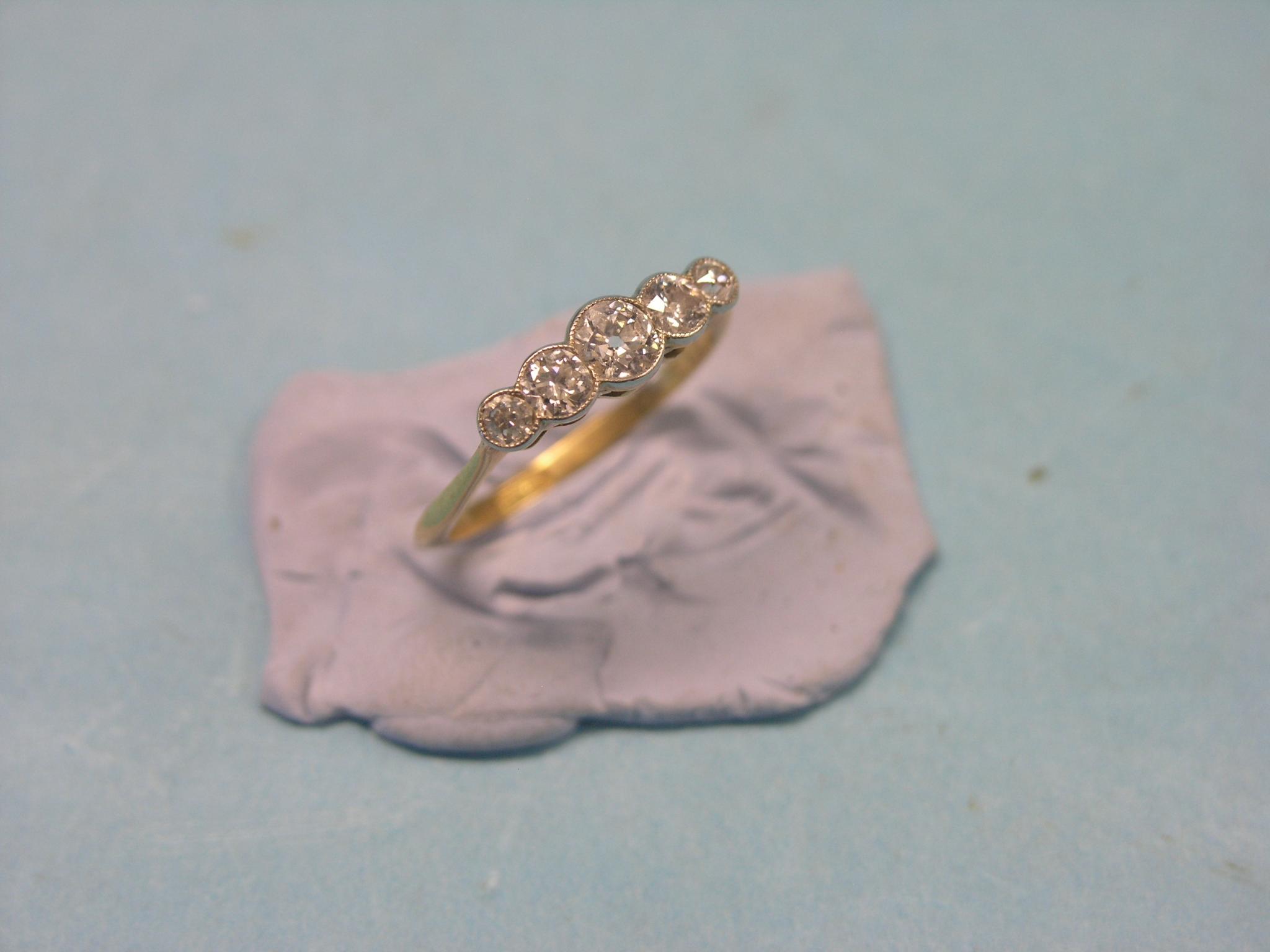 Appraisal: An ct gold and diamond half-hoop ring graduated stones largest