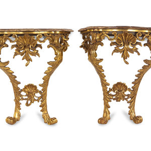 Appraisal: A Pair of Italian Baroque Giltwood Onyx-Top Console Tables Circa