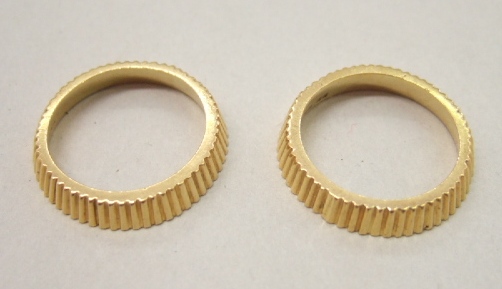 Appraisal: A pair of ct gold band rings by Kutchinsky each