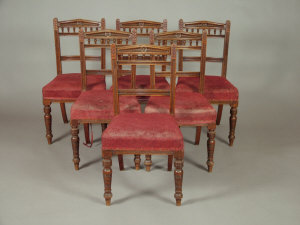 Appraisal: A set of six Edwardian oak dining chairs the spindle