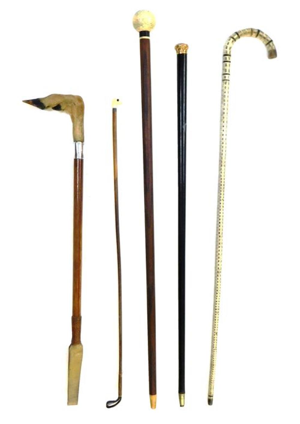 Appraisal: Three th C canes and two whips materials include shark