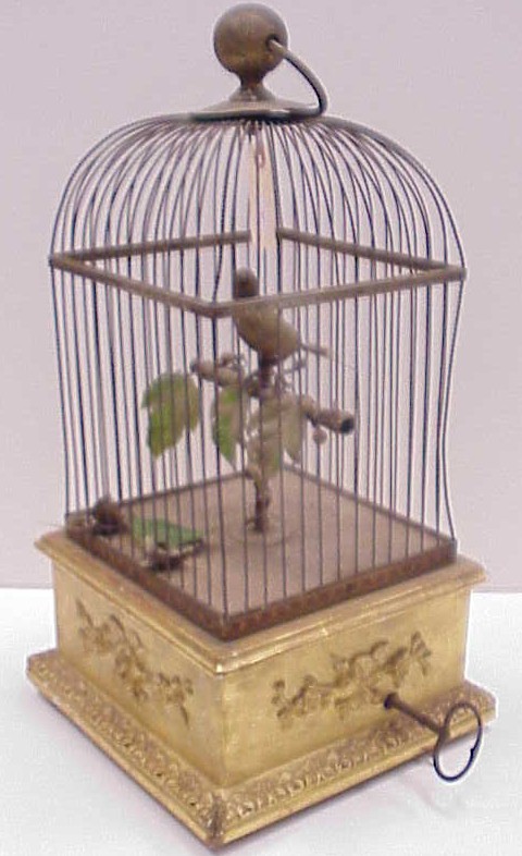 Appraisal: Large keywind musical bird in cage on gilt wood stand