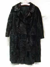 Appraisal: A black and mahogany long fur coat probably astrakhan or