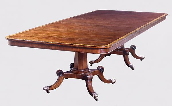 Appraisal: A Regency style mahogany dining table The crossbanded inlaid rectangular