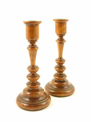 Appraisal: A pair of early th century turned beechwood candlesticks with